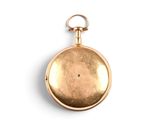 pocket watch on a white surface with a white background