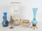 a lot of vases that are sitting on a table