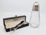silver plated salt and pepper shaker in a box with a spoon