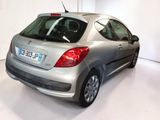 a silver car that is parked in a white room