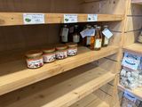 many jars of food on the shelves in the store