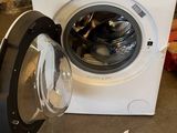 a washing machine that is sitting on the floor