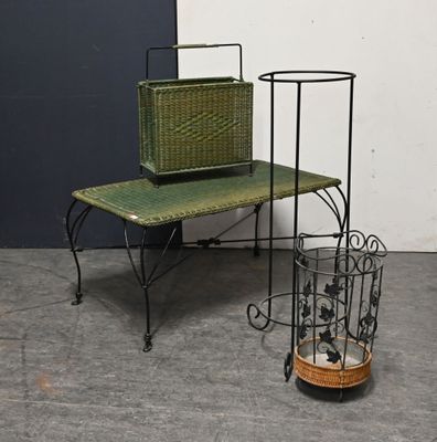 a small table with a basket on top of it next to a small table with a basket on it