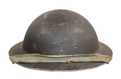 an old helmet with a rope around it on a white background