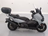 a picture of a motor scooter parked in a white room