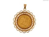 a close up of a gold coin in a pendant on a white background