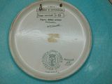 a blue plate with a picture on it on a table