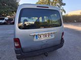 a silver van that is parked in a parking lot