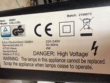a sign on the back of a device that says danger high voltage