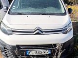 a white van that is parked in the grass