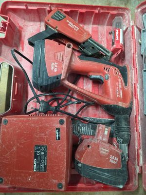 a red tool box with tools in it on the floor