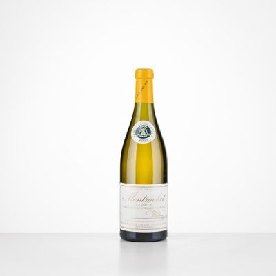 a bottle of white wine sitting on top of a table