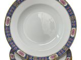 six plates stacked on top of each other on a white surface