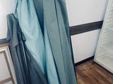 two umbrellas that are sitting on the floor next to a mirror