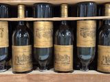 many bottles of wine sitting in a wooden box