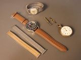 a watch, a watch band, a watch and a watch on a table