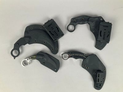 four different types of hand tools sitting on a white surface