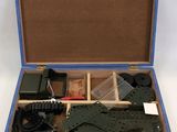 a blue box with tools in it on a white surface