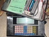 a calculator sitting on top of a box on the floor