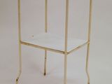 an image of a glass and metal side table