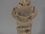 statue of a man holding a bird in his arms
