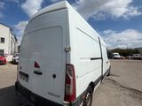 a white van that is parked in a parking lot