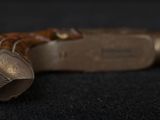 a close up of a cane on a black surface