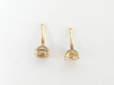 a pair of yellow gold earrings with a white background