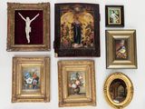 many framed pictures on the wall of this room