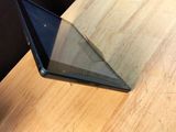 a laptop that is sitting on a wooden table