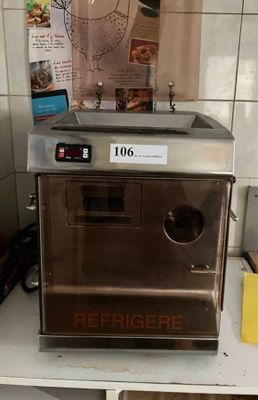 a machine that is sitting on a counter in a kitchen