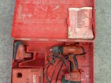 an image of a red tool box with tools inside of it