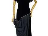 mannequin dressed in black dress on display on white background