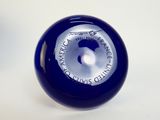 an image of a close up of a blue glass object on a white surface