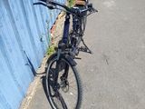 a bicycle parked on the side of the road