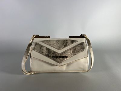 a white purse with a chevron design on the front