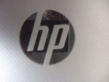 a close up of a hp logo on a laptop