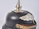 an old helmet with a winged decoration on the top of it