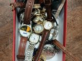 a box full of watches and other watches on a table