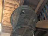 two baskets hanging from the ceiling of a room