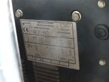 a close up of a metal panel with some screws on it