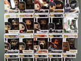 a lot of pop vinyl figures on display on the table