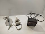 two lamps that are on a table next to each other