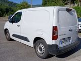 a white van that is parked in a parking lot