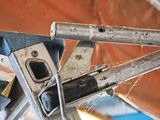 a close up of a piece of metal that is hanging from a ceiling
