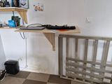a desk with a keyboard and a monitor on it