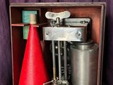 a red cone sitting on top of a wooden box