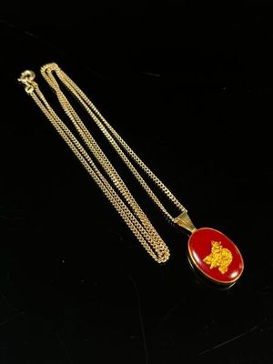 CHAINE en or jaune 750 millièmes, retenant un pendentif oval…