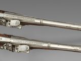 pair of silver - plated flints with wooden handles and wooden handles