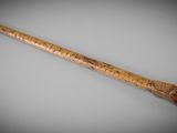 an image of a wooden stick with a snake head on it